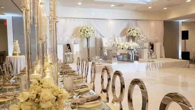 Elegant Harborside Ballroom with floral centerpieces, perfect for weddings and corporate events.