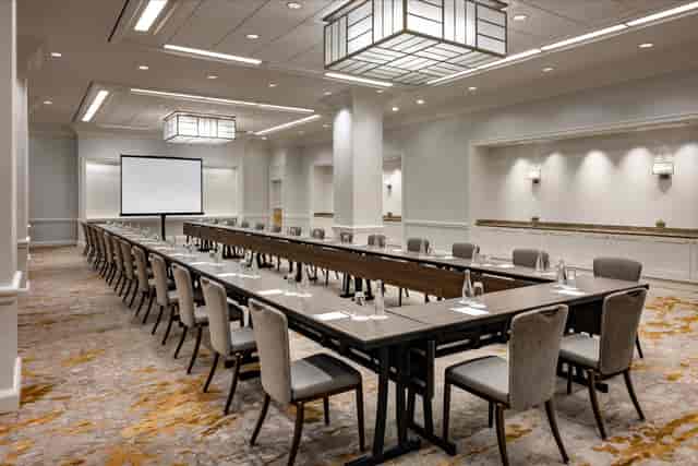 Resolute Conference Room with flexible table setup for corporate events and presentations.