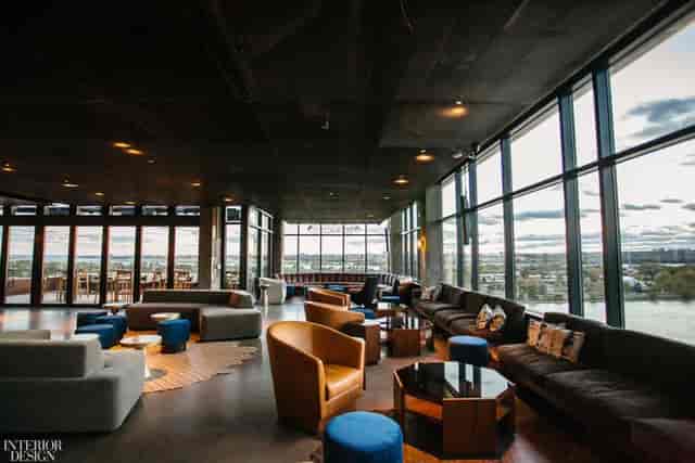 Modern event space with expansive windows, ideal for networking and social gatherings.