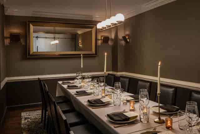 Elegant dining room at BRABO Tasting Room, ideal for corporate dinners and gatherings.