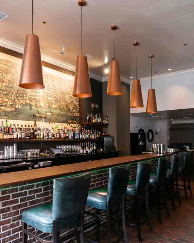 Stylish bar at Freedom Terrace, Archer Hotel Alexandria for networking events and cocktail receptions.