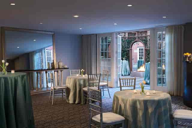 Lorien Suite at Archer Hotel: elegant event space with blue tables, perfect for receptions.