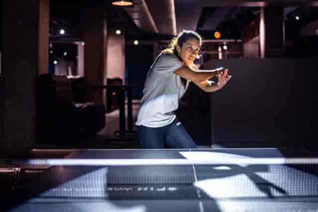 Dynamic event space with participant in interactive activity, ideal for team-building and workshops.
