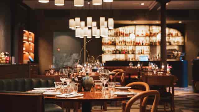 Sophisticated Nobis Hotel bar with elegant decor for corporate dinners and gatherings.