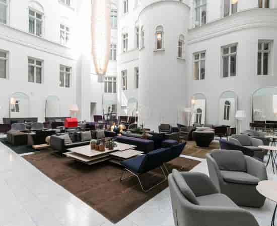Elegant lounge at Nobis Hotel, ideal for networking events and informal meetings.