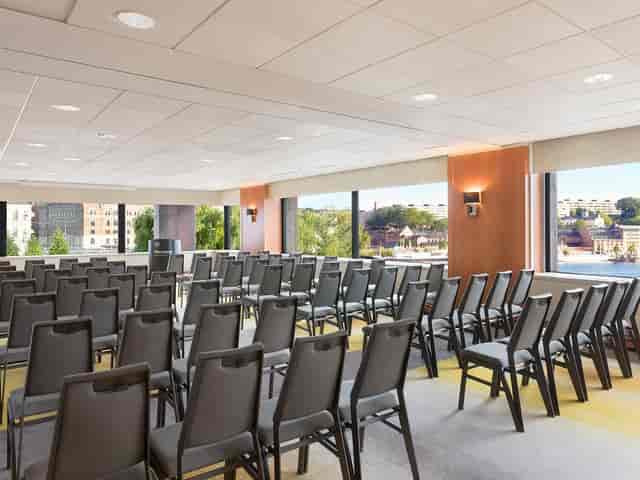 Drottningholmsalen B meeting room with natural light for corporate events and workshops.