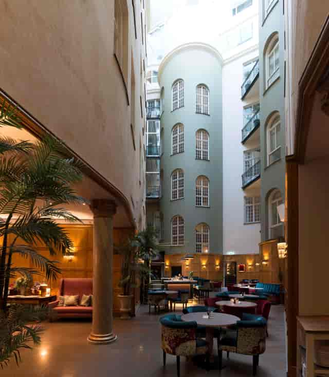 Stylish banquet hall atrium at Hotel Kung Carl, ideal for networking events and receptions.