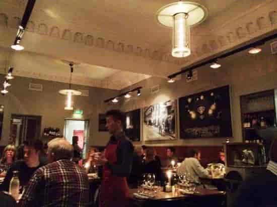 Vibrant Nalen Restaurang with warm lighting, perfect for gatherings and events.