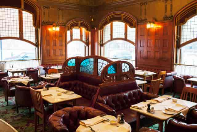 Elegant restaurant interior with wooden paneling, ideal for corporate events and private dining.