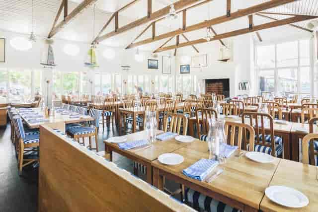 Spacious banquet hall with nautical decor, perfect for events and gatherings.