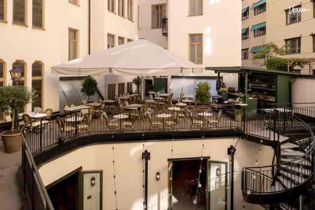 Charming outdoor event venue at The Sparrow Hotel with elegant seating and greenery.