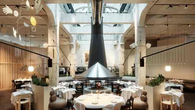 Modern chef's table in India with elegant settings, ideal for upscale events and gatherings.