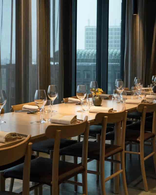 Elegant dining setup in La Tour Chambre Séparée for corporate events and meetings.