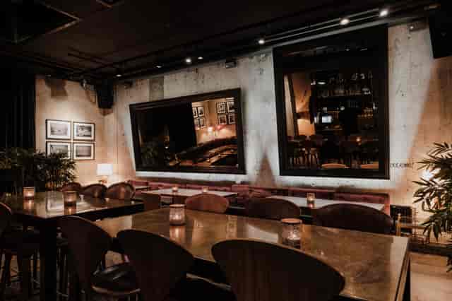 Stylish restaurant venue with warm lighting for upscale events and corporate meetings.