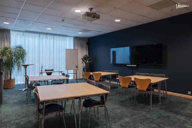 Conference center at Clarion Hotel Sign with flexible seating for workshops and presentations.