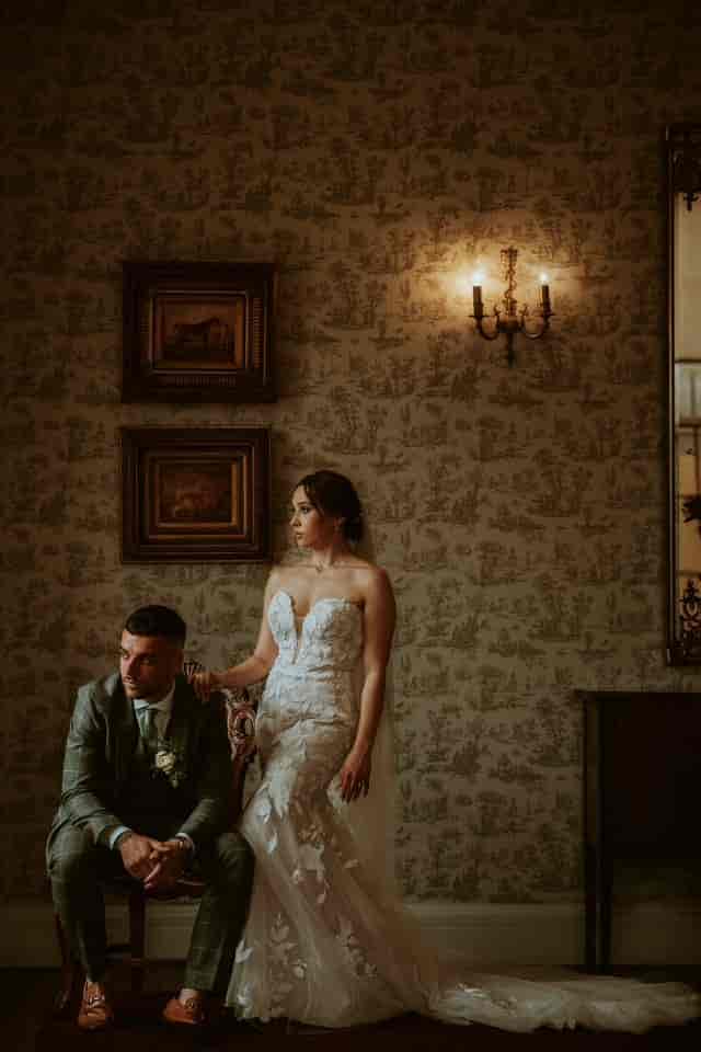Elegant couple in Drawing Room, Parklands Quendon Hall, perfect for wedding photography.