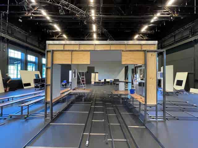 Partially constructed event space with stage framework at Dansens Hus for dynamic exhibitions.