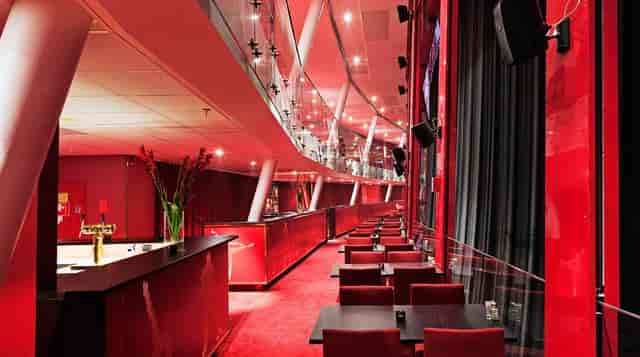 Rooftop Terrace at Quality Hotel Globe, modern event space with vibrant red decor for upscale gatherings.