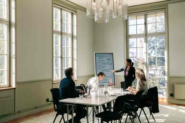 Conference center meeting room with large windows, ideal for productive events and collaboration.