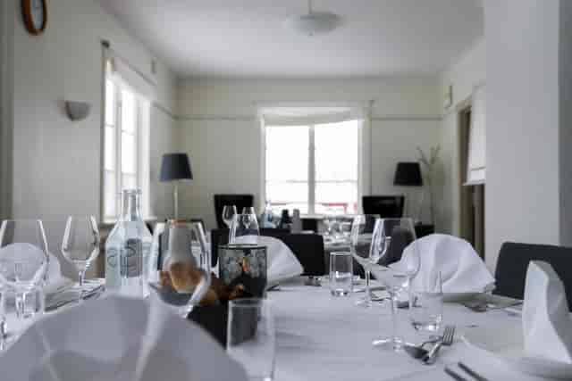 Conference room with elegant tableware for intimate meetings at Stora Brännbo Hotel.