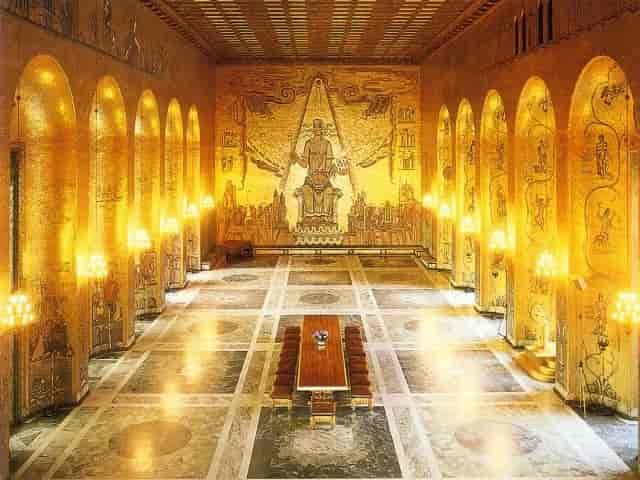Gyllene salen in Stockholm City Hall, featuring opulent gold decor for gala events.