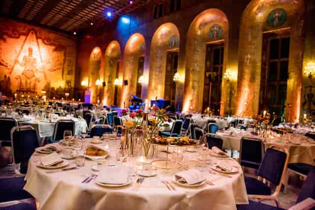 Elegant banquet hall in Gyllene salen, Stockholm City Hall, ideal for weddings and galas.