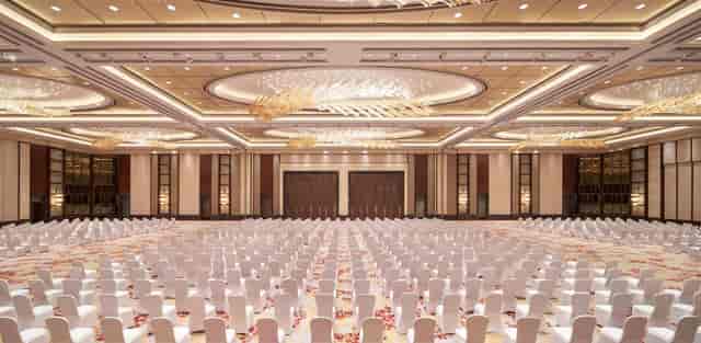 Elegant conference hall in Kerry Hotel Pudong, Shanghai with white chairs for events.
