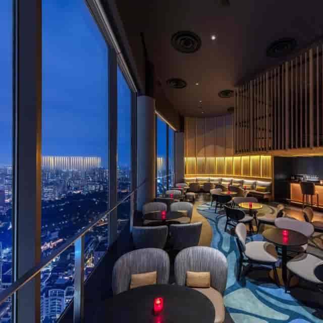 Sophisticated restaurant event space with city views, ideal for meetings and receptions.