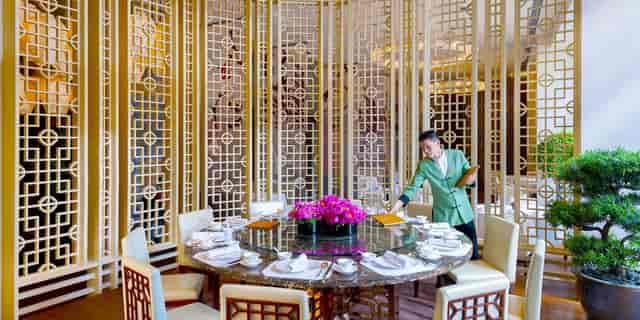 Elegant dining table in The Boardroom, Capella Shanghai for corporate events and gatherings.