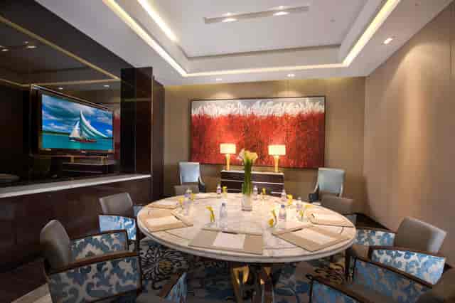 Sophisticated meeting room with round table at Kempinski Hotel Shanghai for corporate events.