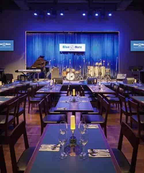 Jazz club stage at Blue Note China, featuring blue lighting for live performances and events.