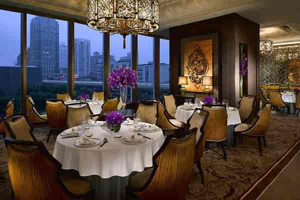 Elegant open dining area with plush seating for upscale events and corporate dinners.