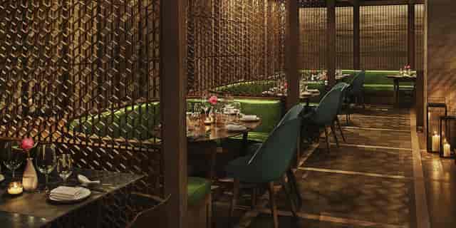 Private dining room in Shanghai Me Restaurant with green benches, ideal for upscale events.