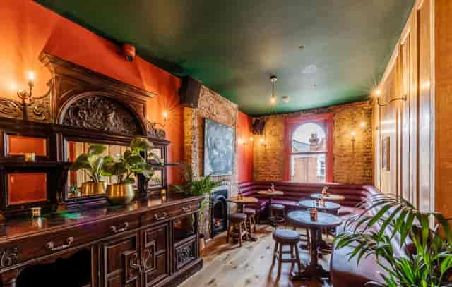 Cozy co-working space in Queen of The South Pub, ideal for networking events and gatherings.