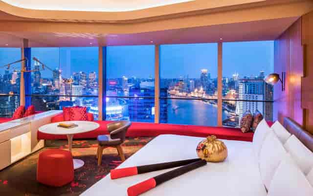 Stylish W Shanghai hotel room with panoramic views for VIP events and meetings.