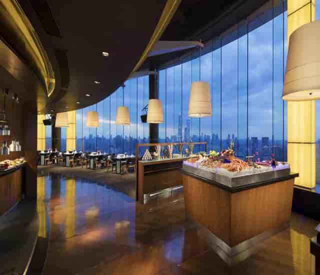 Elegant dining space with panoramic views at DoubleTree Shanghai for upscale events.