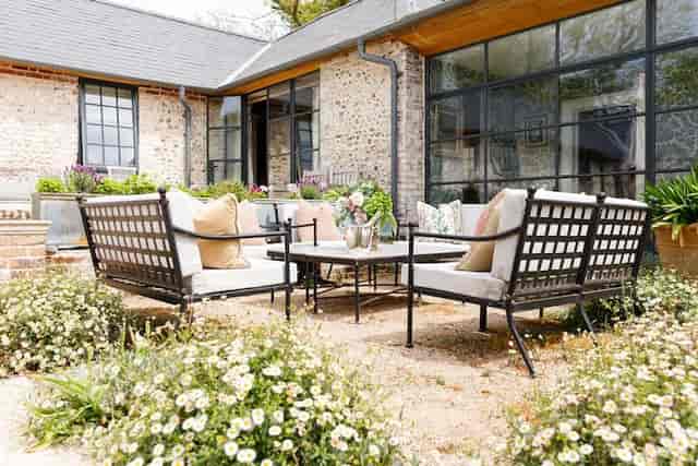 Charming outdoor seating in Courtyard Garden for networking events and casual meetings.
