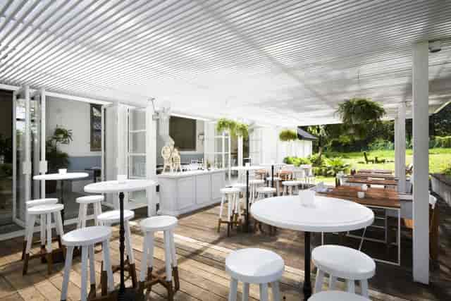 Outdoor event space at The White Rabbit with greenery, ideal for workshops and receptions.