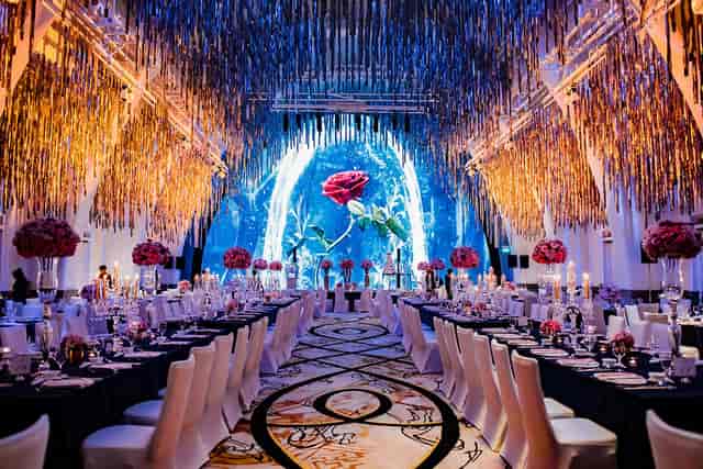 Grand Ballroom at JW Marriott Singapore, elegant gala venue with floral centerpieces.