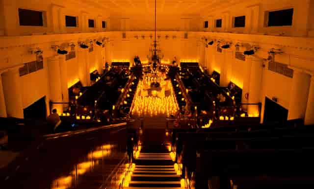 Elegant event space with warm lighting, ideal for corporate gatherings and upscale events.