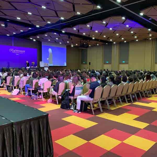 Garnet Meeting Rooms 213-218 at Singapore EXPO, vibrant carpet, conference setup.