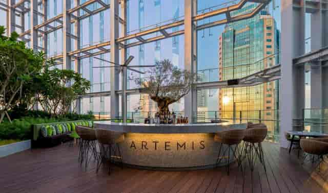 Rooftop dining at Artemis Grill & Sky Bar with city views, ideal for upscale events.