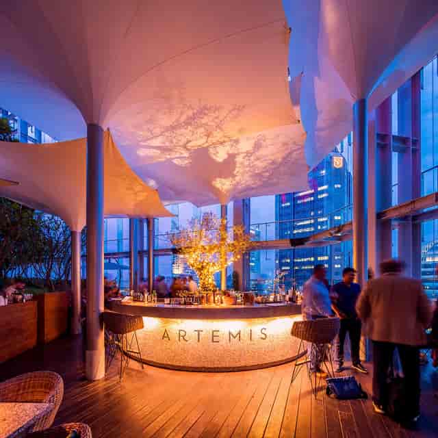 CBD Set Lunch at Artemis Grill & Sky Bar with city skyline backdrop, perfect for upscale events.