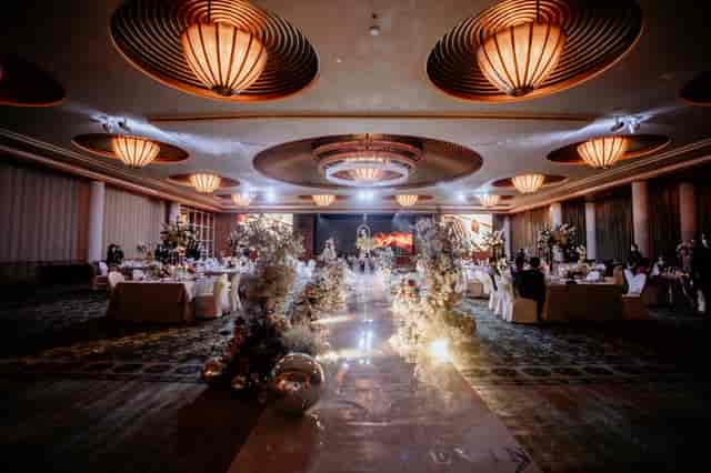 Grand Ballroom at The Ritz-Carlton, Singapore with elegant tables for weddings and corporate events.
