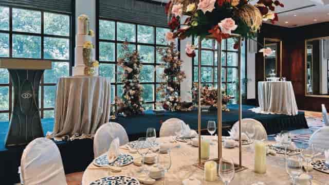 Elegant Saffron Ballroom with floral centerpieces, perfect for weddings and corporate events.