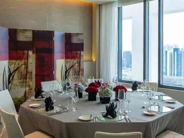 Elegant dining setup at Sky Villas, ideal for corporate meetings and high-end events.