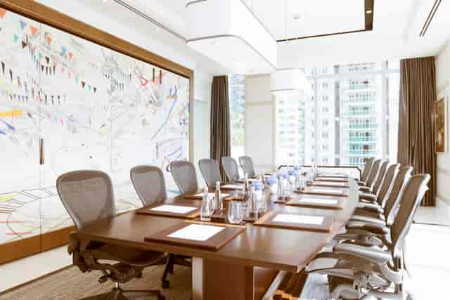 Modern conference room at Raffles Hotels, ideal for meetings and brainstorming sessions.