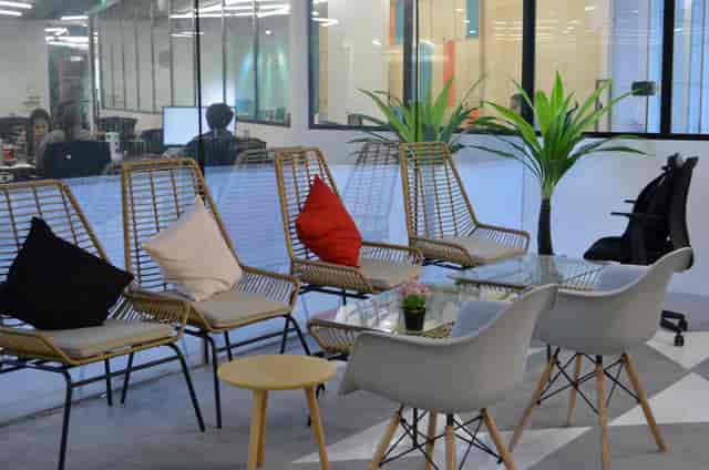 Modern lounge area with glass walls for informal meetings and networking at *SCAPE.