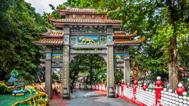 Traditional archway in Haw Par Villa's Sculpture Garden, perfect for cultural events.