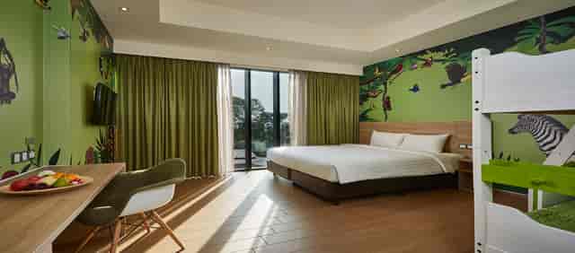 Comfortable hotel suite with nature-themed decor, perfect for events and meetings.